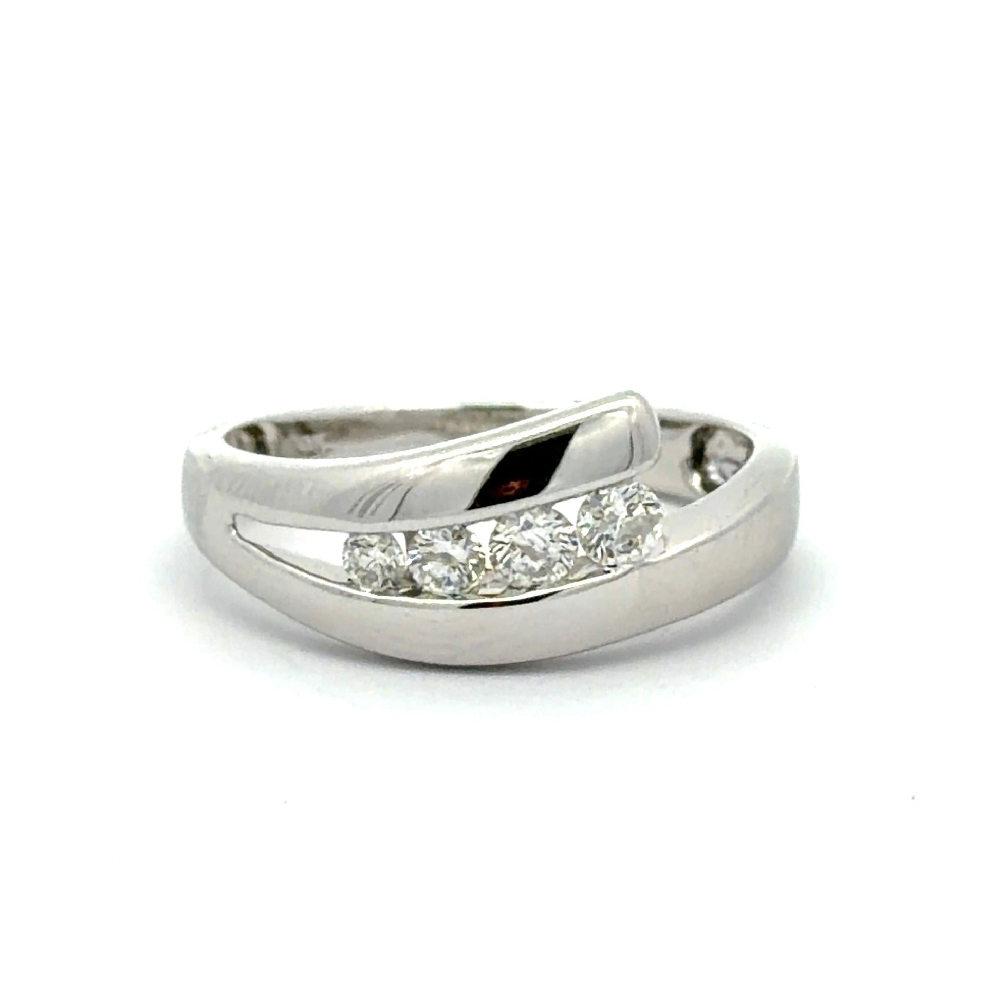 White gold ring with 4 round diamonds on a white background