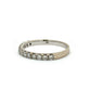 A white gold diamond eternity band ring, featuring a row of round-cut diamonds set in a polished band, shown against a plain white background with AG engraved inside band