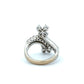 Back of white gold ring with floral design on a white background