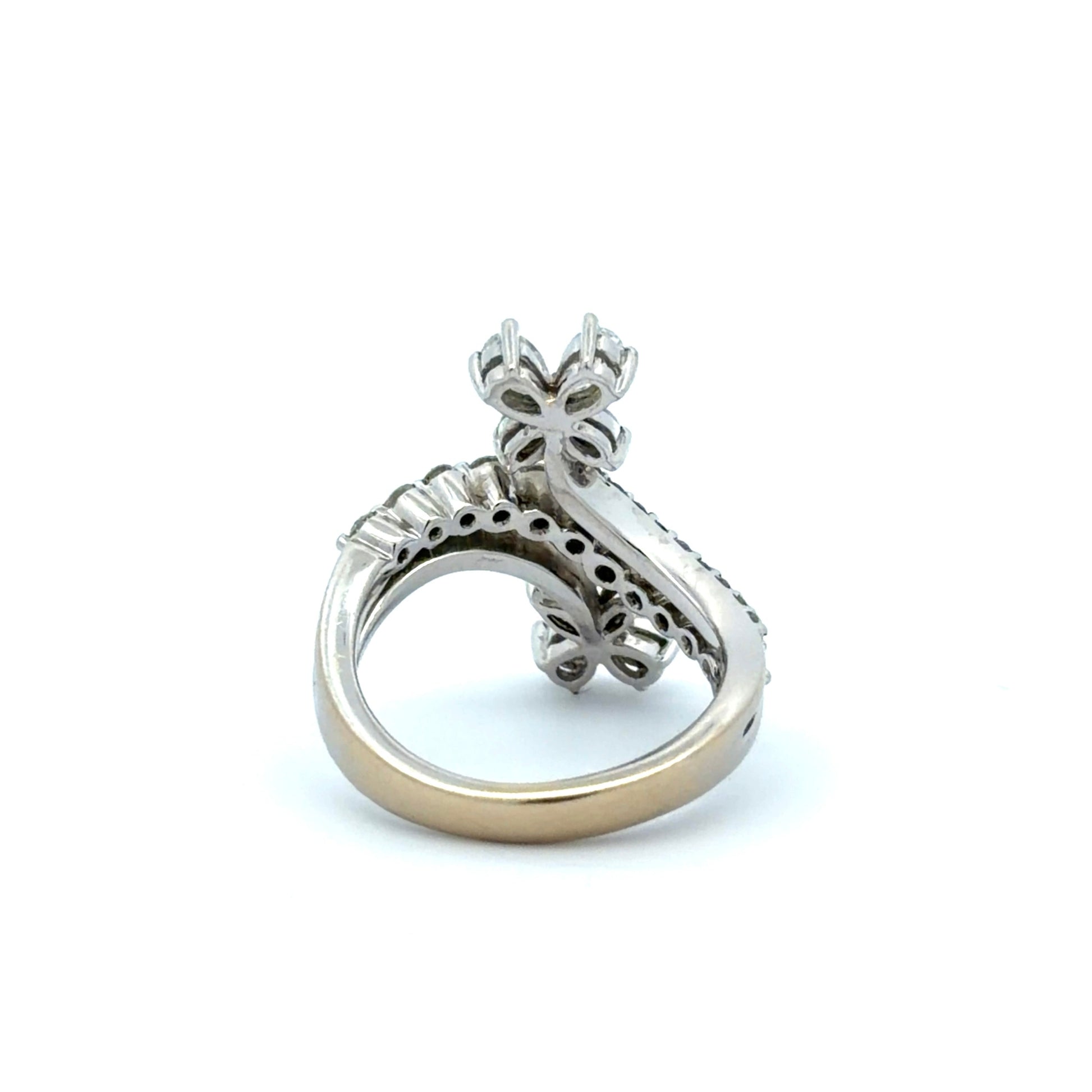 Back of white gold ring with floral design on a white background
