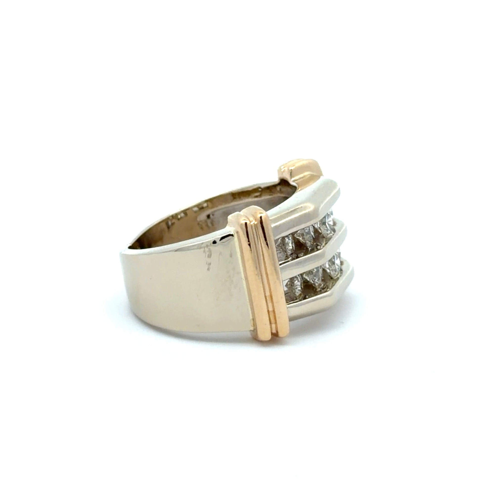 Gold and white gold ring with diamond accents on a white background