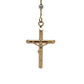 A yellow gold crucifix pendant necklace with a detailed figure of Jesus on the cross, suspended from a  gold chain shown against a plain white background.