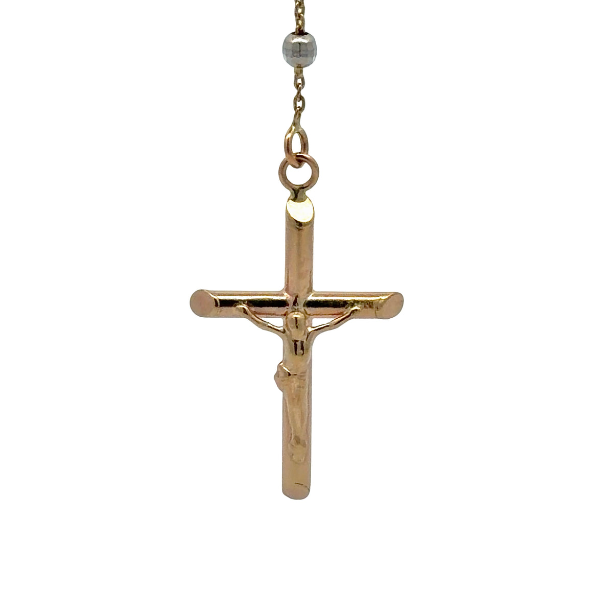 A yellow gold crucifix pendant necklace with a detailed figure of Jesus on the cross, suspended from a  gold chain shown against a plain white background.