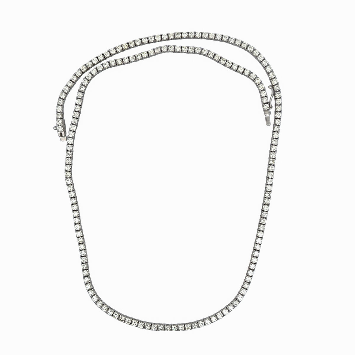 14K white gold round diamond tennis necklace arranged in a loop, showing the diamond setting and clasp