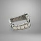 Silver metal watch strap on a gray background