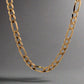 Front of Figaro link chain in yellow gold