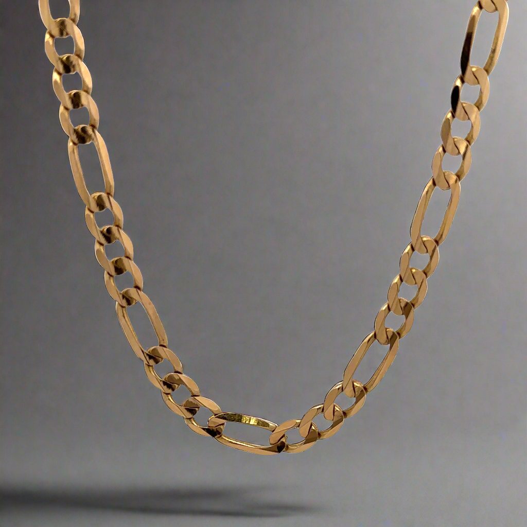 Front of Figaro link chain in yellow gold