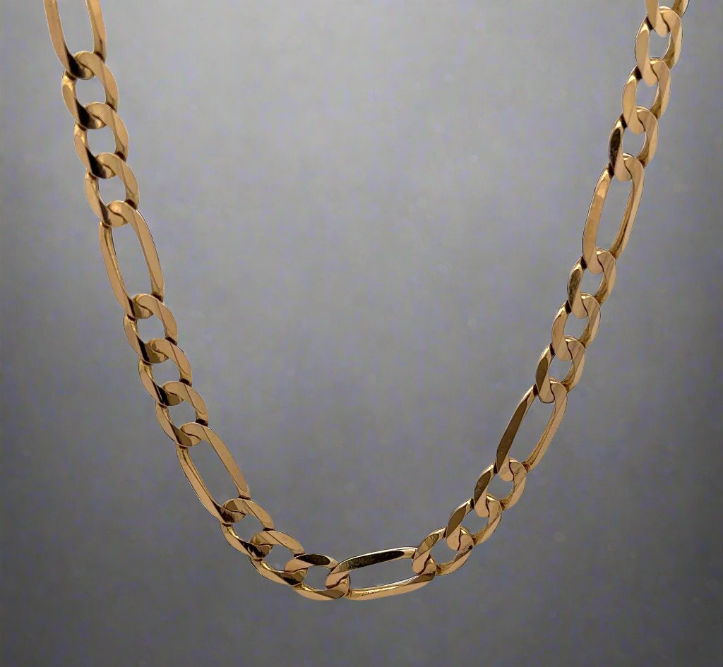 Back of Figaro link chain in yellow gold