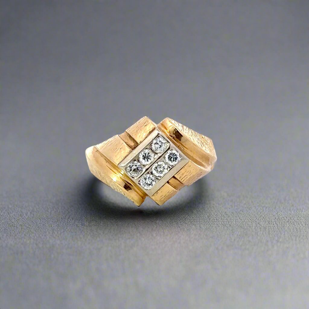 Front of yellow gold ring with white gold center and 9 diamonds