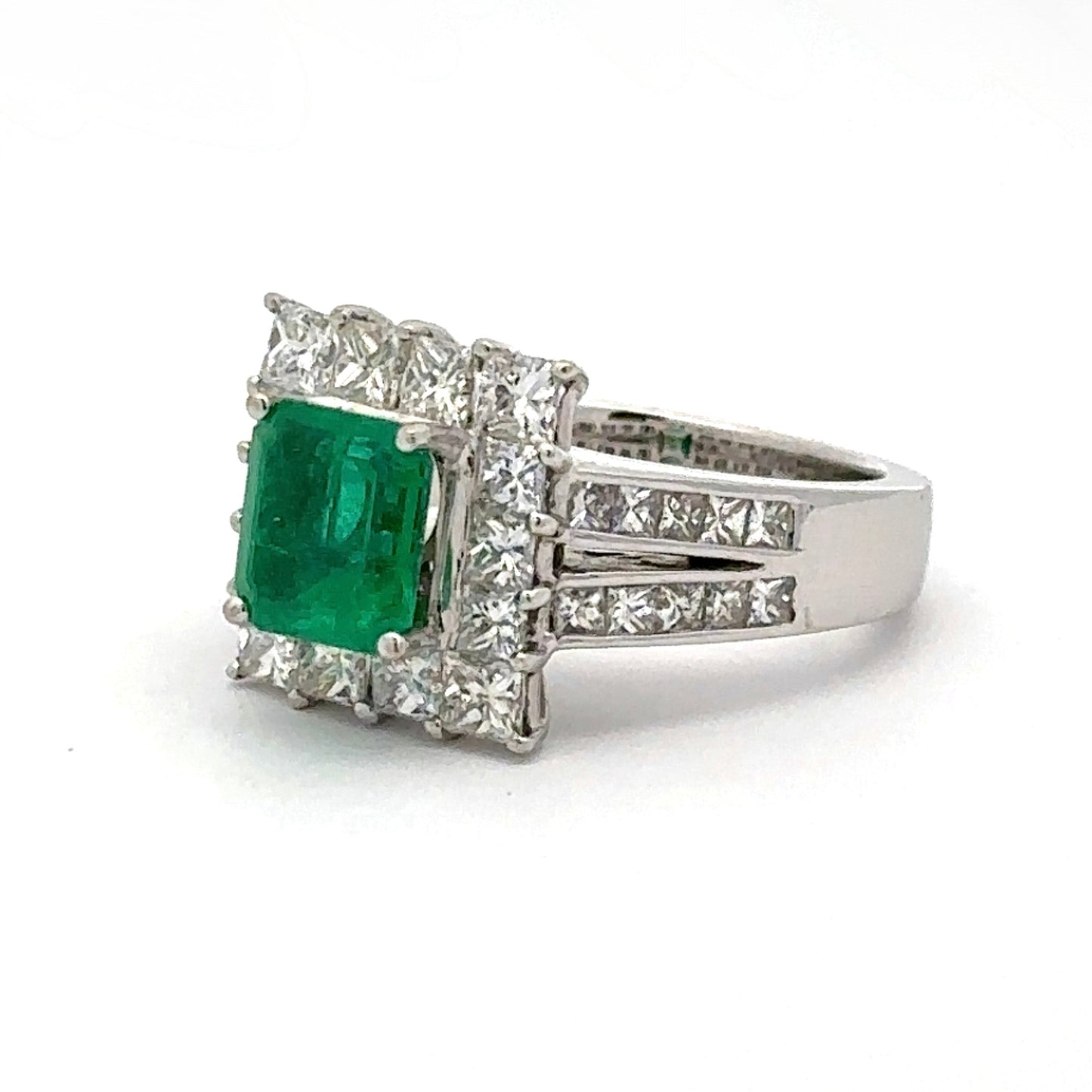 White gold ring with green gemstone