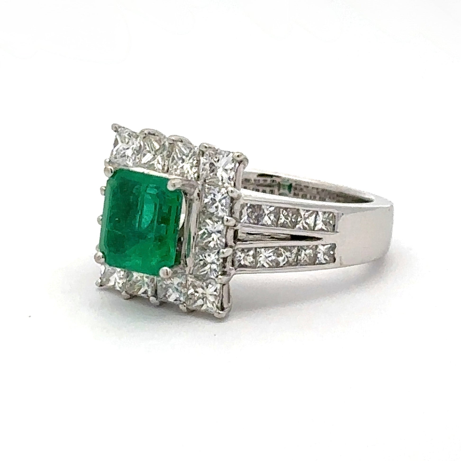 White gold ring with green gemstone