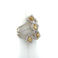 A multi-band ring with yellow diamonds and silver-colored metal settings, displayed on a white cone-shaped ring stand against a white background.