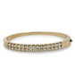 Gold bracelet with diamonds on a white background
