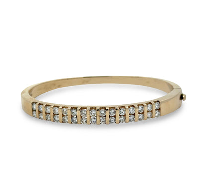 Gold bracelet with diamonds on a white background