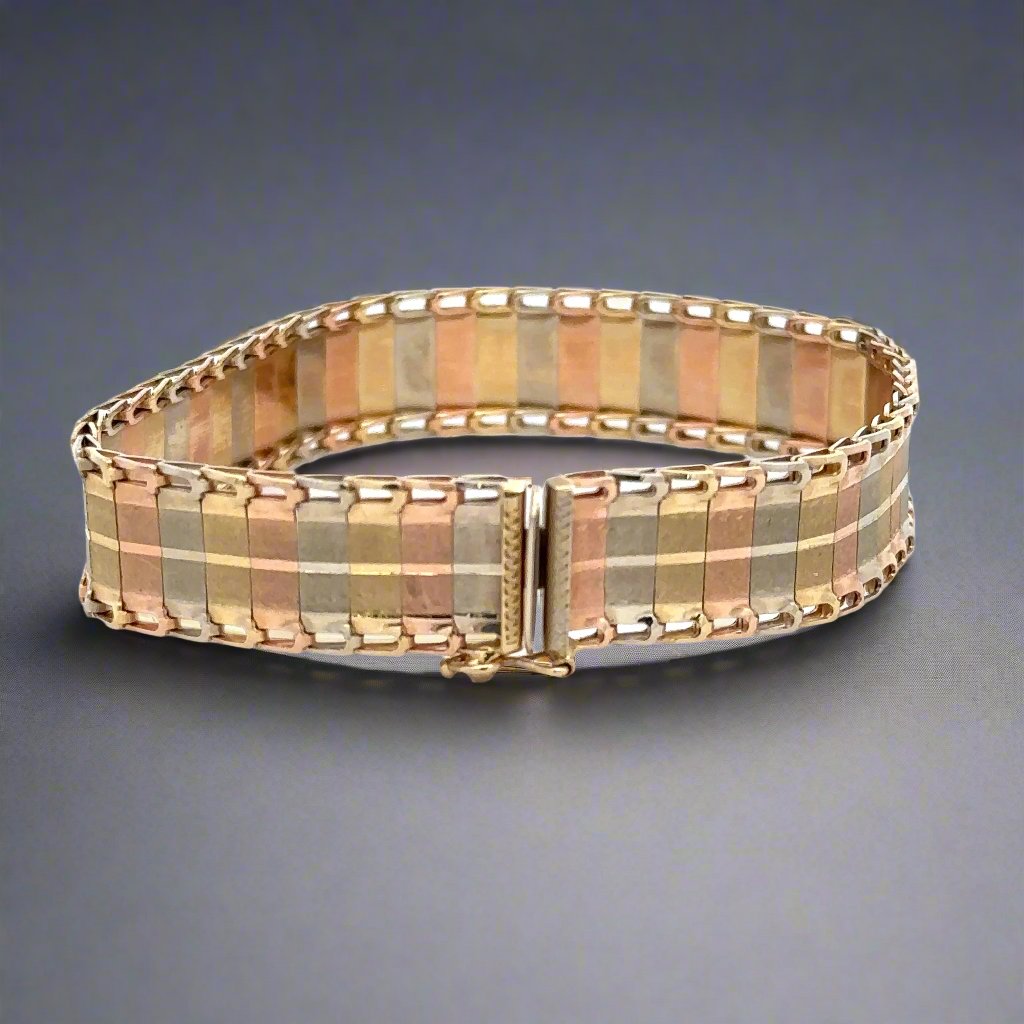 Back of tri color gold bracelet with safety lock