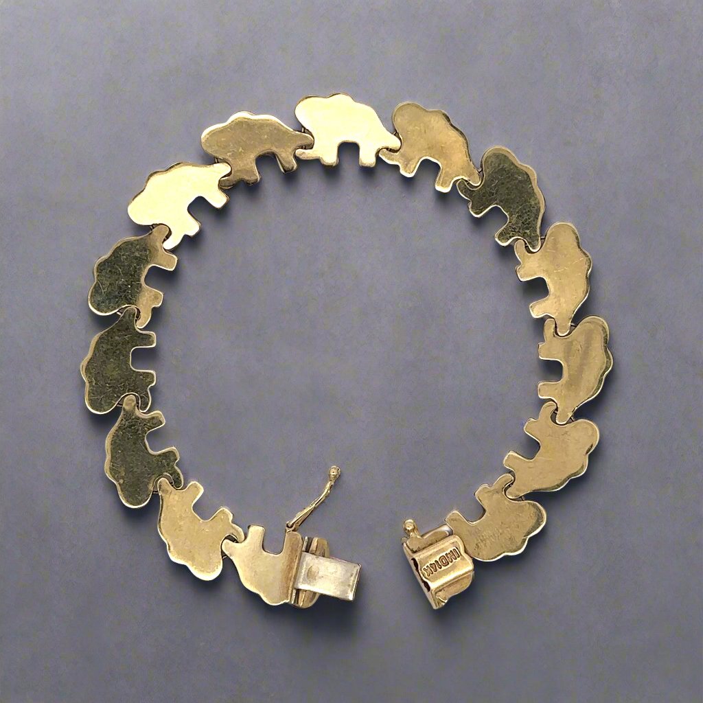 Back of elephant bracelet in yellow gold with 14K stamp on clasp