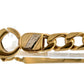 Close up of OMS engraved on a small piece of white gold on the link 
