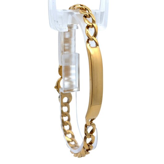 Gold ID bracelet on white background