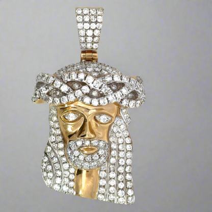 Front of the 10K Diamond Jesus pendant. Diamonds cover the hair, eyes, facial hair, top of the head, and barrel.