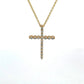front of yellow gold diamond cross necklace