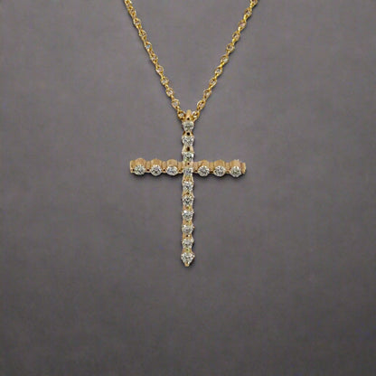 front of yellow gold diamond cross necklace