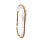 A gold-toned anklet displayed on a clear plastic hanger against a plain white background.
