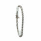 Side view of 18K white gold natural diamond tennis bracelet showing round diamond links and clasp