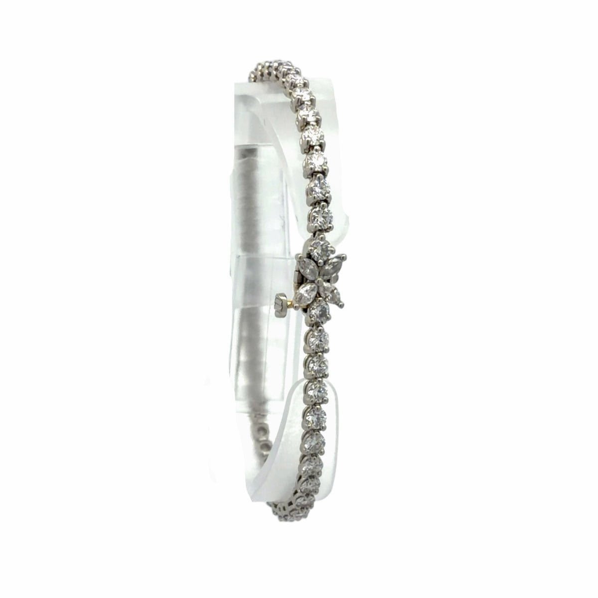18K white gold natural diamond tennis bracelet featuring round diamonds and a marquise-shaped diamond floral accent
