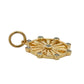 Side of gold pendant on white background
