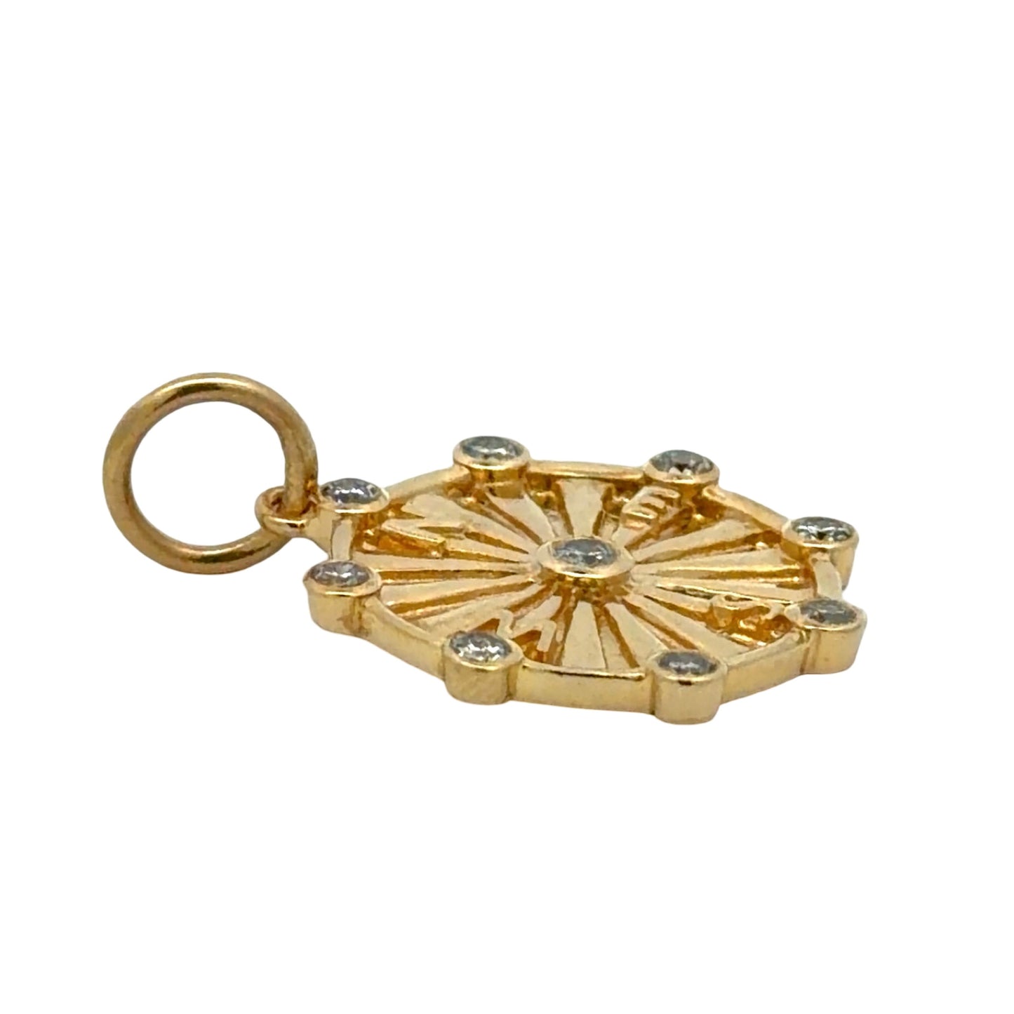 Side of gold pendant on white background