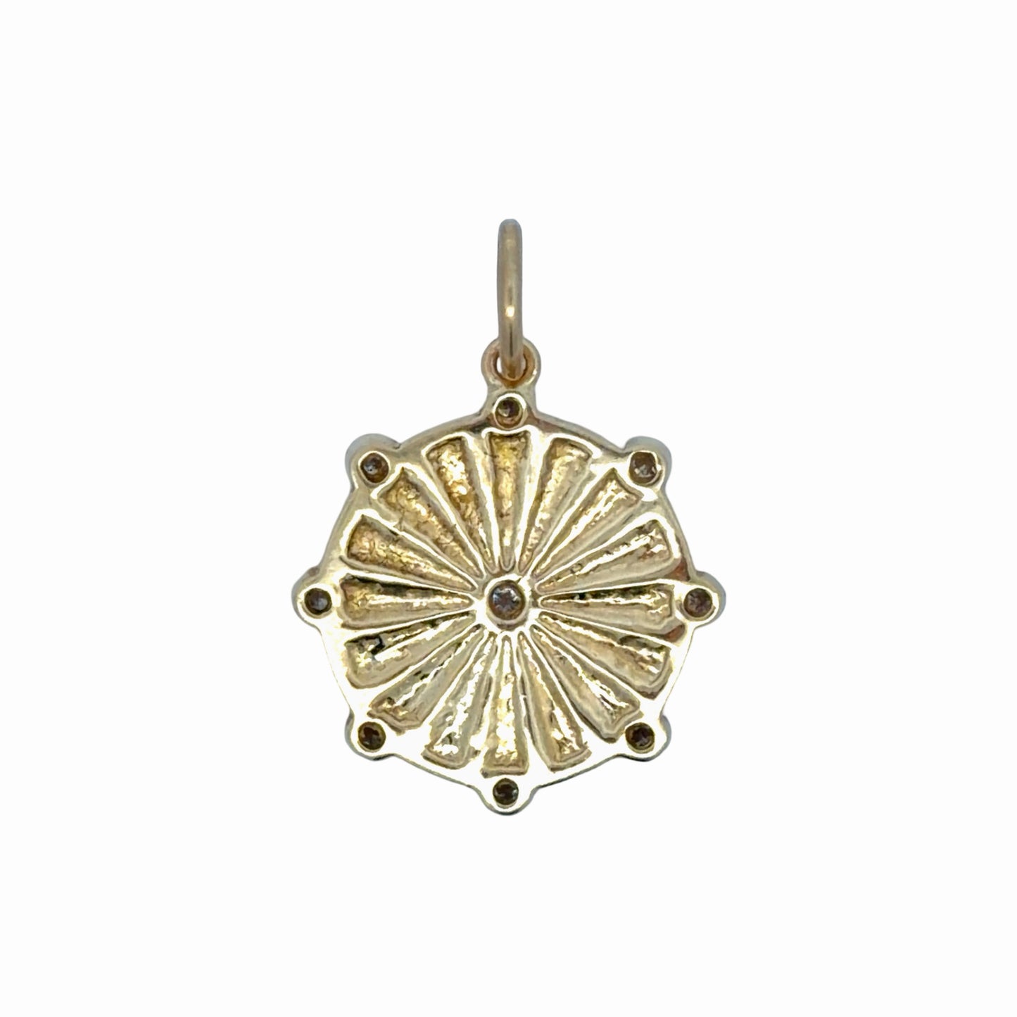 Back of gold pendant on white background