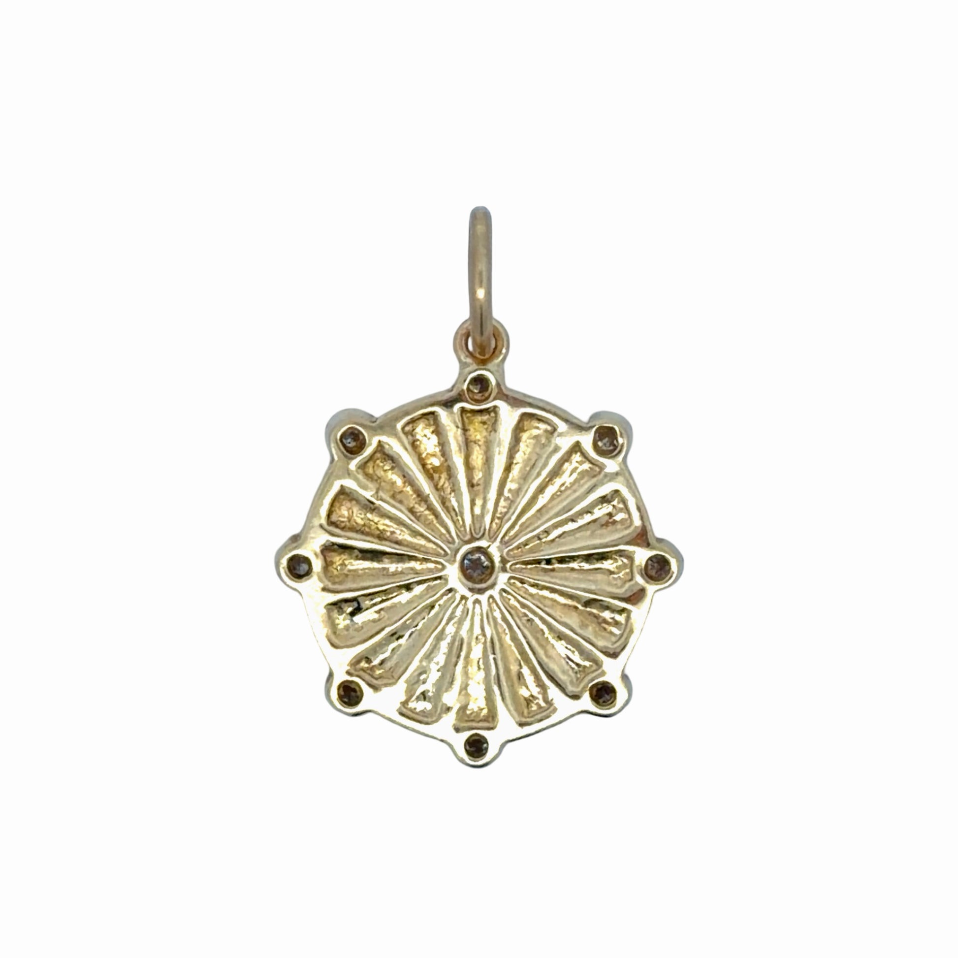 Back of gold pendant on white background