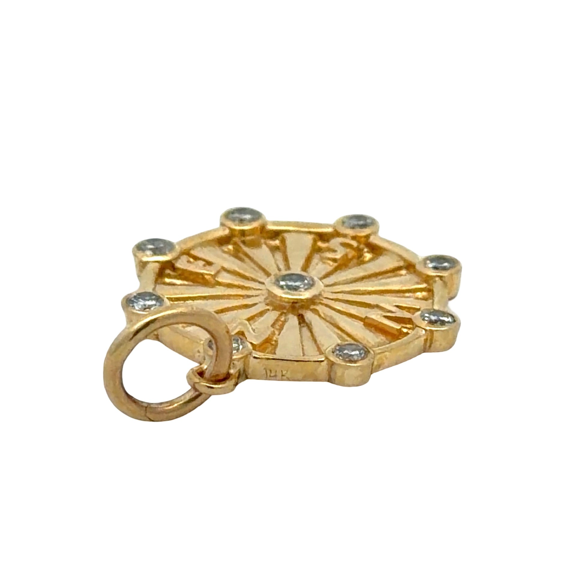 14K stamp on gold compass pendant on white background