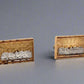 Diagonal view of last supper stud earrings