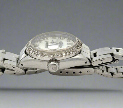 Side of watch with crown and scratches