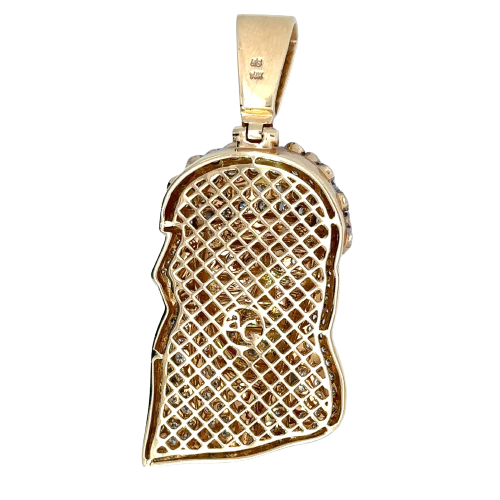 Back of the diamond Jesus pendant. 14K stamp on barrel. Open back, hollow gold. "ag" on back. Light scratches on gold.