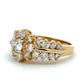 Gold ring with diamonds on a white background
