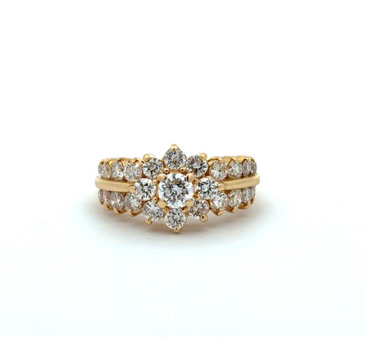 Gold ring with diamond accents on a white background