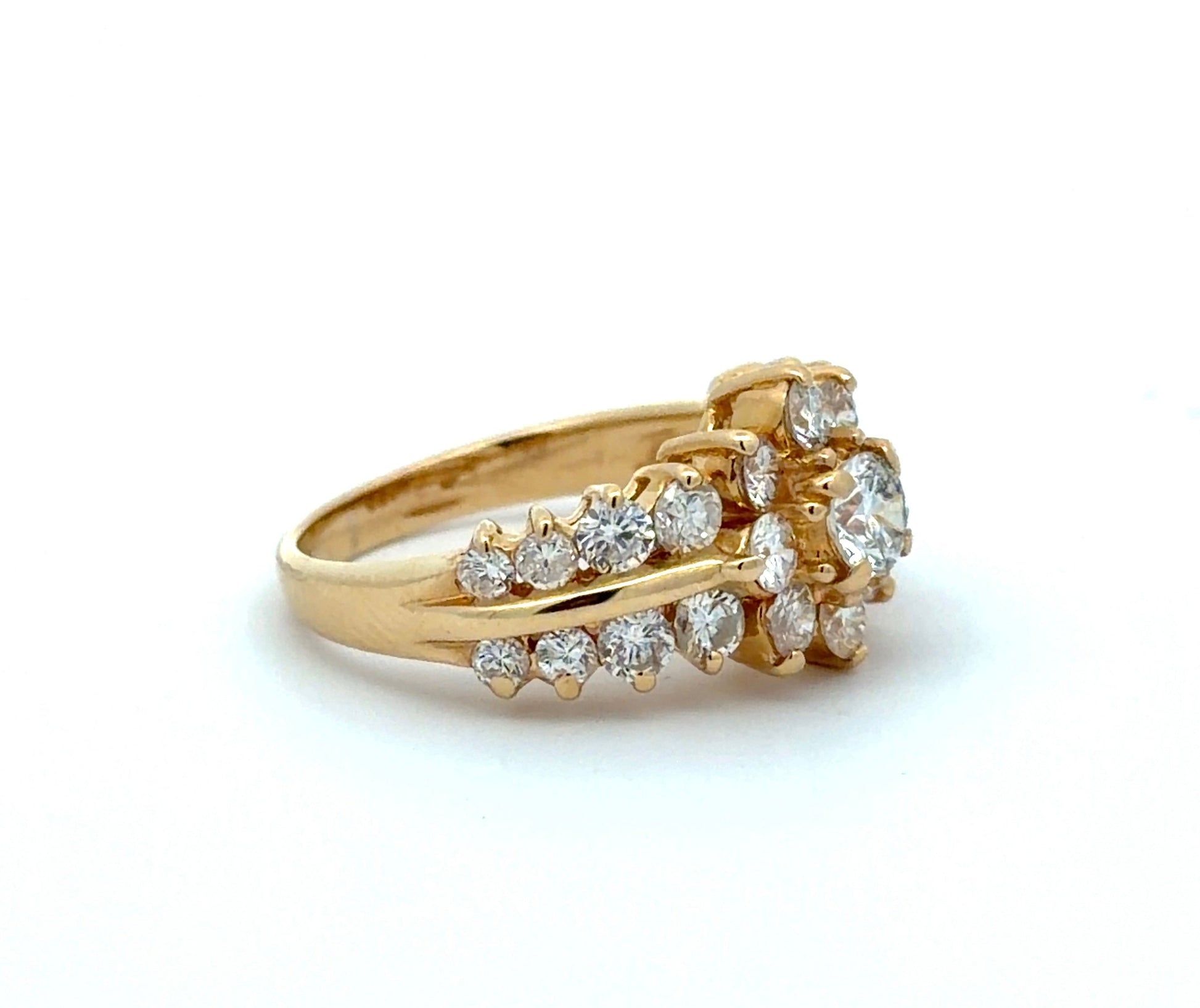 Gold ring with diamonds on a white background