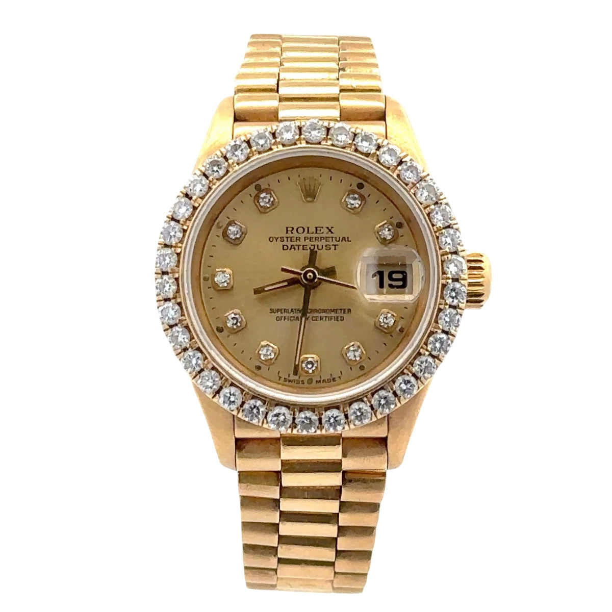 Gold watch with diamond-studded bezel on a white background
