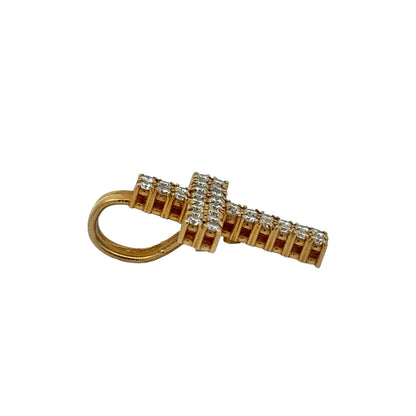 Side of gold cross pendant