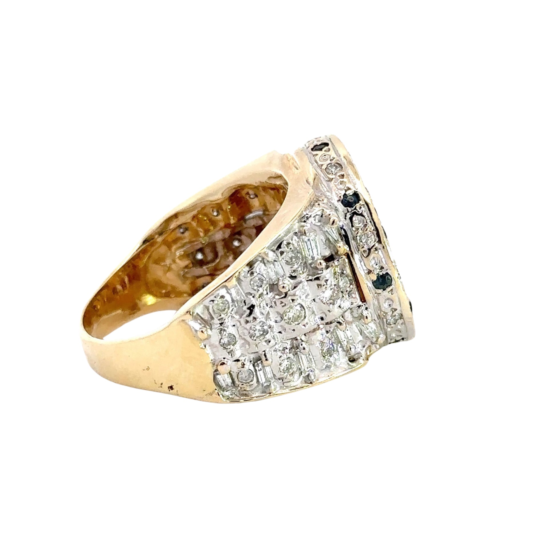 Side of ring with round + baguette diamonds with scratch on gold. 