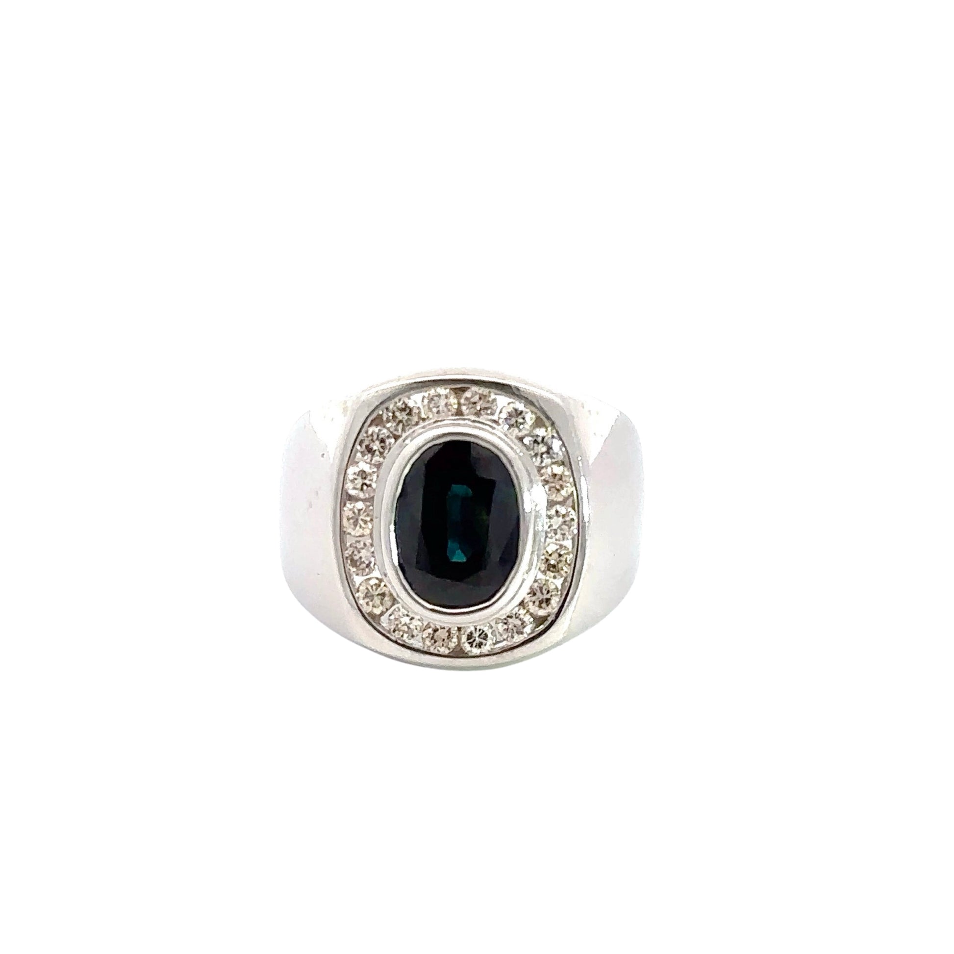 Front of white gold dome shaped ring with 1 dark blue oval-shaped Sapphire in center and  18 round diamonds surrounding it. Shows scratches on gold 