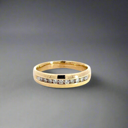 Front of yellow gold diamond band ring with 10 round diamonds on half the band