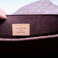 close up of louis vuitton leather logo