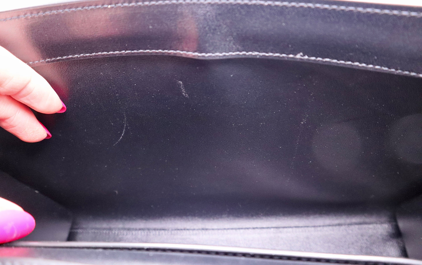 Inside of YSL bag with scuff marks on side