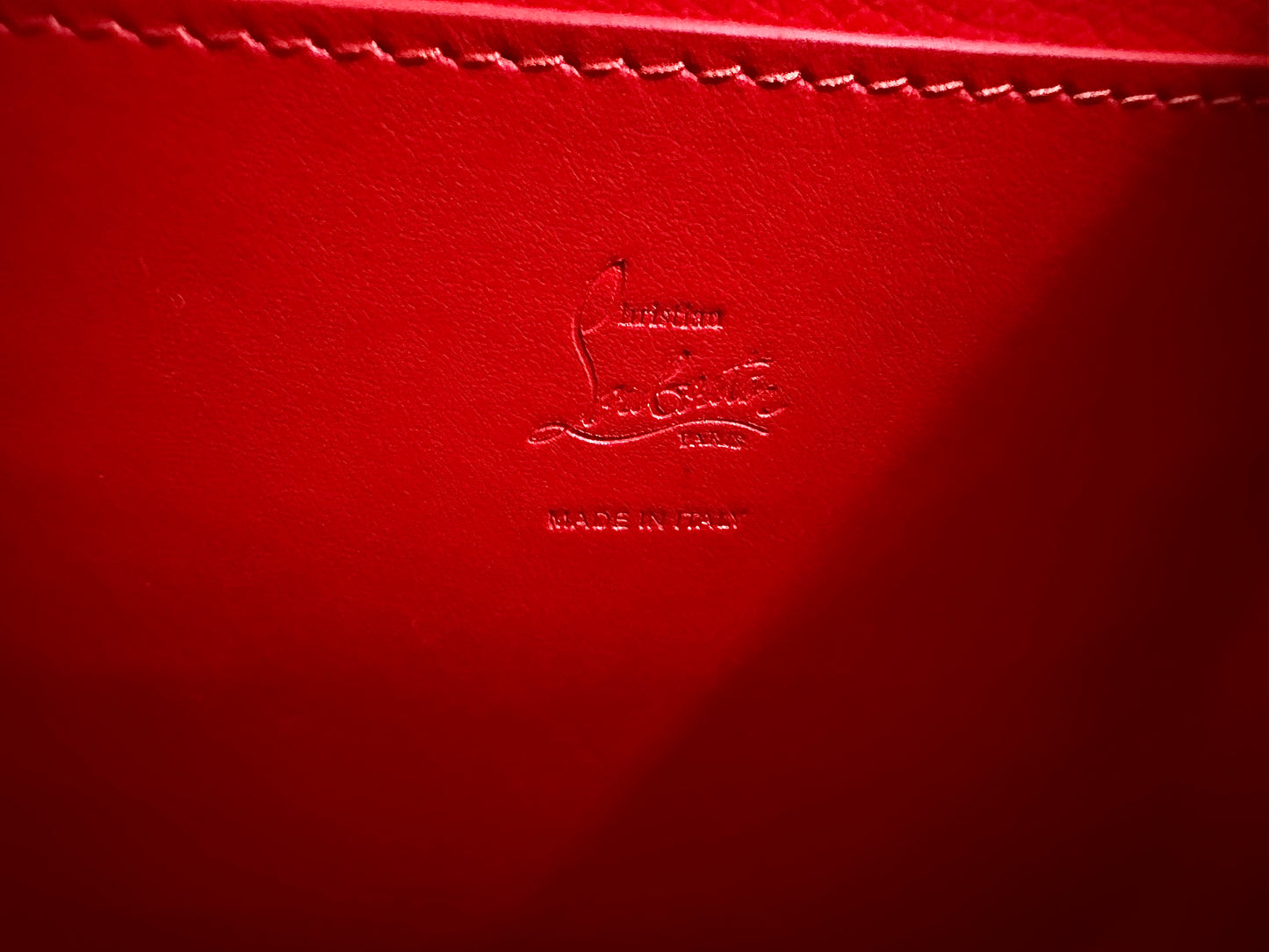Christian Louboutin stamp inside purse.