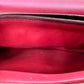 Scuff marks on red leather inside bag