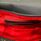 Red interior of pocket with black card slots