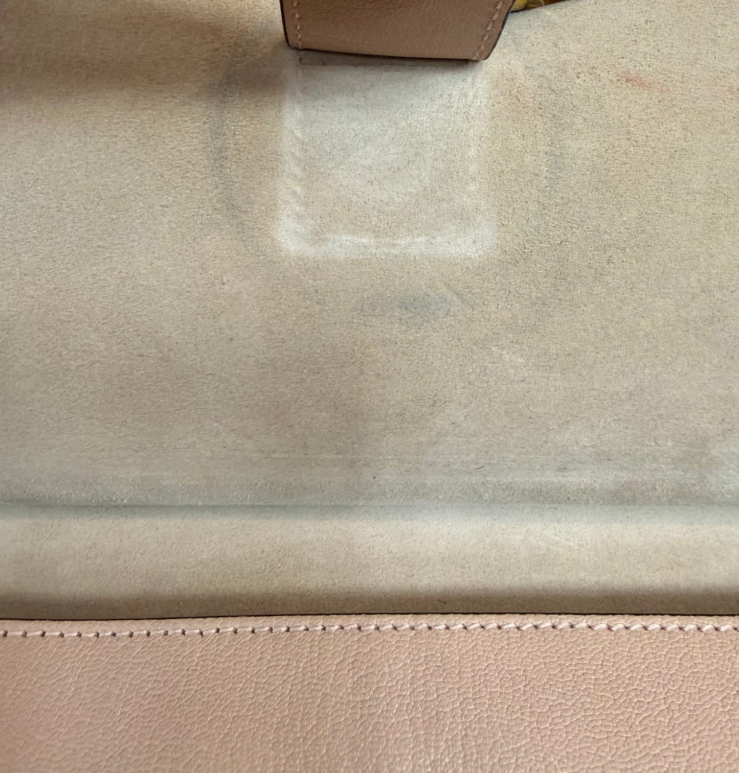 Close up of interior with discoloraqtion under the button closure